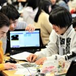 Photo of Japanese and Finnish students making projects during a Code School Finland's education camp in Oulu March 2019.